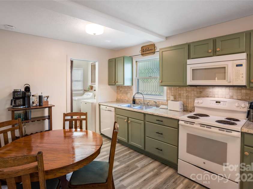 26 Pebblebrook Street, Clyde, NC 28721.  MLS# CAR4268095, YatesRealty ID 25732. Cabinets were recently painted in soft green hue.