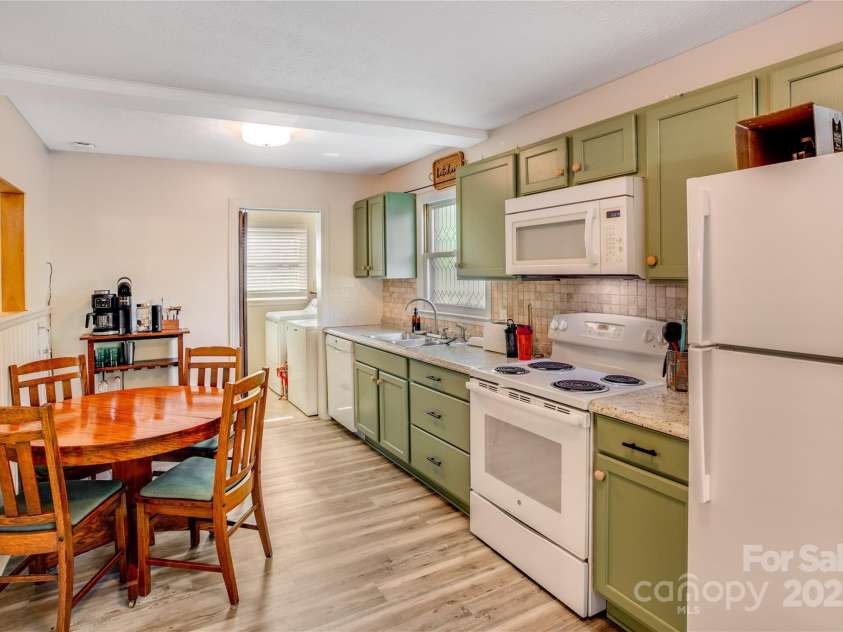 26 Pebblebrook Street, Clyde, NC 28721.  MLS# CAR4268095, YatesRealty ID 25732. Laundry room adjoins the kitchen with full size washer & dryer.