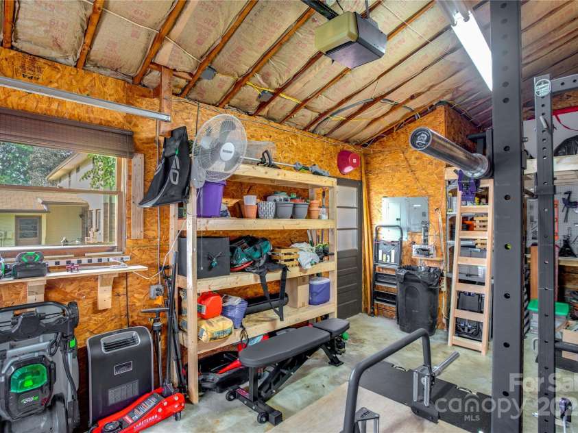 26 Pebblebrook Street, Clyde, NC 28721.  MLS# CAR4268095, YatesRealty ID 25732. Plenty of built-in storage in garage.