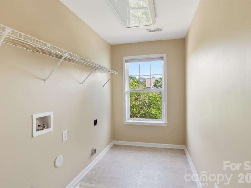 7816 Whisperingwood Drive, Harrisburg, NC 28075.  MLS# CAR4377272, YatesRealty ID 25732. 2nd Floor Laundry