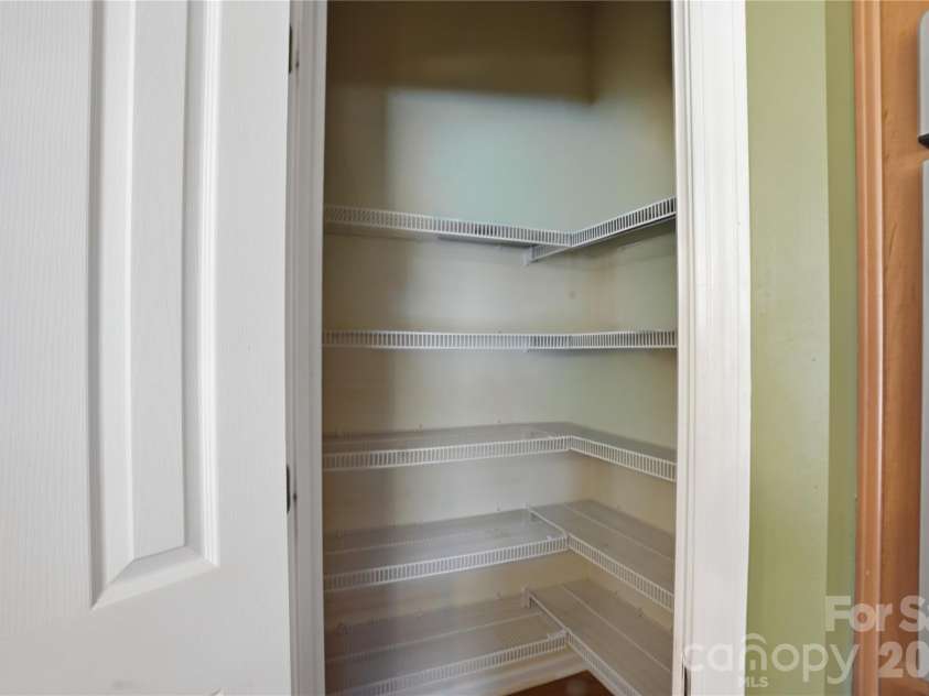 7816 Whisperingwood Drive, Harrisburg, NC 28075.  MLS# CAR4377272, YatesRealty ID 25732. Kitchen Pantry