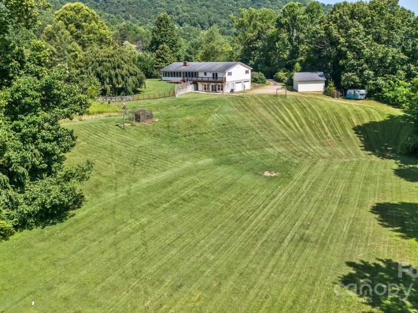 170 Beaverdam Loop Road, Candler, NC 28715.  MLS# CAR4271034, YatesRealty ID 25735. Amazingly flat and spacious meadow for recreation, animals, or gardening.