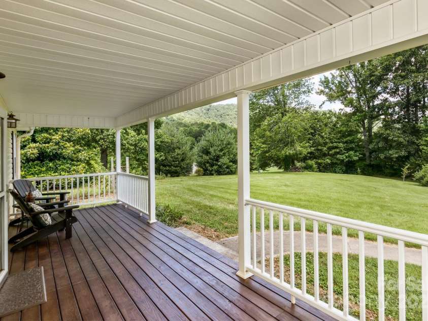 170 Beaverdam Loop Road, Candler, NC 28715.  MLS# CAR4271034, YatesRealty ID 25735. Beautiful rocking chair front porch