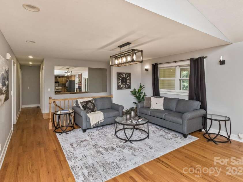 170 Beaverdam Loop Road, Candler, NC 28715.  MLS# CAR4271034, YatesRealty ID 25735. Main living area with hardwood floors and high ceilings