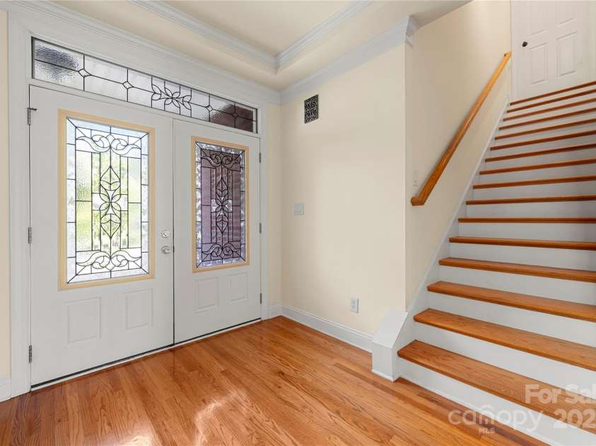 765 Cherry Hills Place, Rock Hill, SC 29730.  MLS# CAR4270626, YatesRealty ID 25736. Foyer with hardwood stairs to the finished room over garage