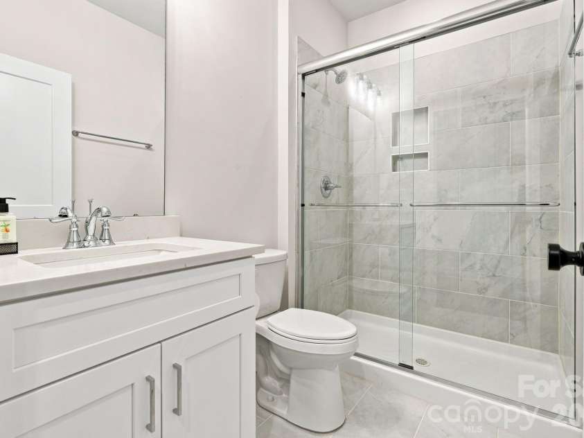 212 Wesser Street, Davidson, NC 28036.  MLS# CAR4381623, YatesRealty ID 25737. Downstairs Bath