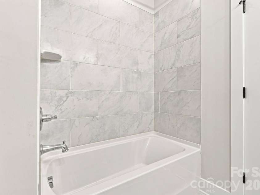 212 Wesser Street, Davidson, NC 28036.  MLS# CAR4381623, YatesRealty ID 25737. Upstairs Bathroom