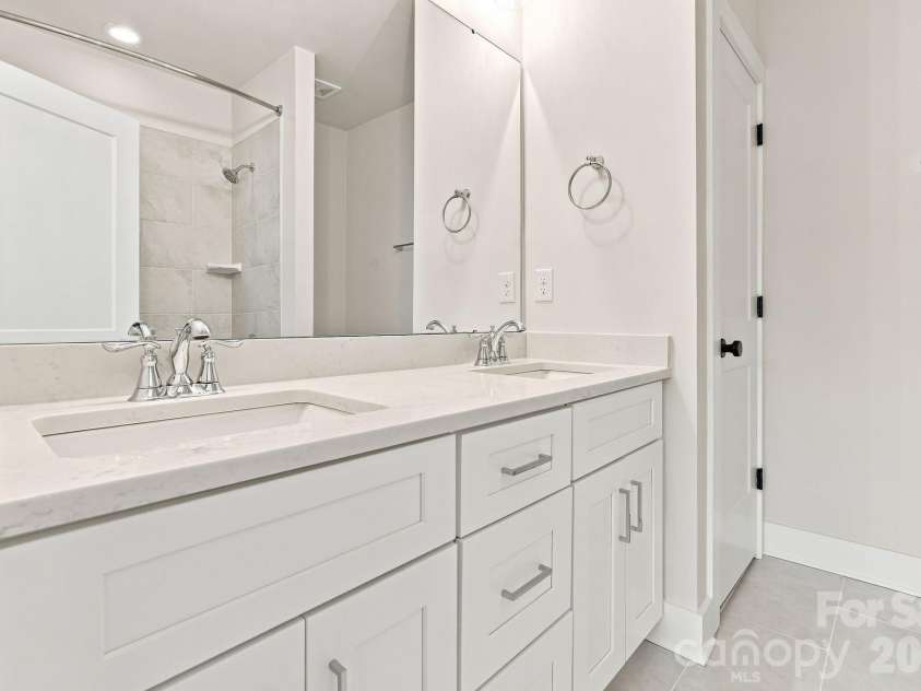 212 Wesser Street, Davidson, NC 28036.  MLS# CAR4381623, YatesRealty ID 25737. Upstairs Bathroom