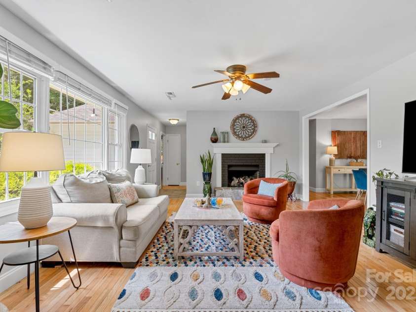 10 Daniel Lane, Black Mountain, NC 28711.  MLS# CAR4274400, YatesRealty ID 25738. Light Filled Living Room Flows to Dining