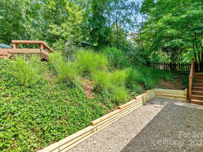 10 Daniel Lane, Black Mountain, NC 28711.  MLS# CAR4274400, YatesRealty ID 25738. Mature Landscaping with New Timber Wall