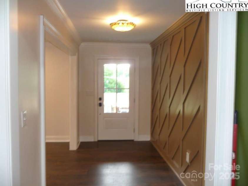 384 New River Heights, Boone, NC 28607.  MLS# CAR4304432, YatesRealty ID 2574. Entry with wood accent wall