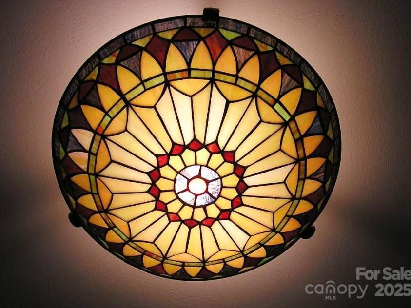 384 New River Heights, Boone, NC 28607.  MLS# CAR4304432, YatesRealty ID 2574. Stained Glass Entry Light