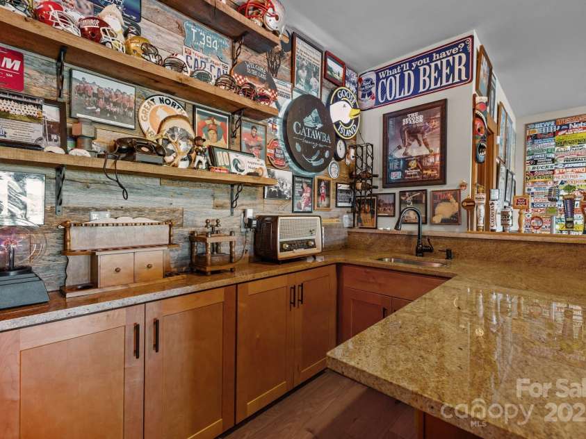 10108 Saw Mill Road, Charlotte, NC 28278.  MLS# CAR4268919, YatesRealty ID 25740. Basement bar area with bar sink