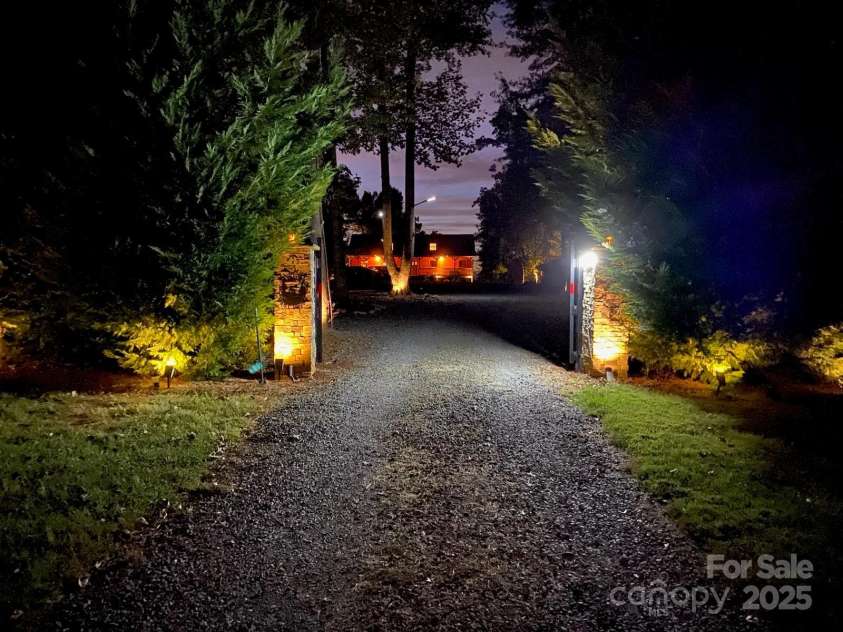 10108 Saw Mill Road, Charlotte, NC 28278.  MLS# CAR4268919, YatesRealty ID 25740. Front entrance night time view