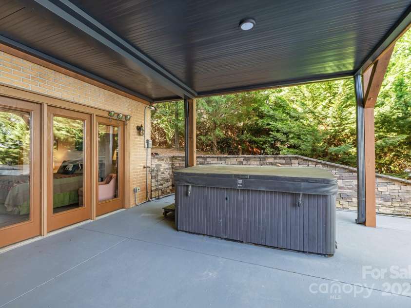 10108 Saw Mill Road, Charlotte, NC 28278.  MLS# CAR4268919, YatesRealty ID 25740. Hot tub on lower deck