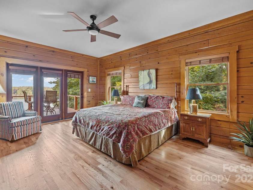 10108 Saw Mill Road, Charlotte, NC 28278.  MLS# CAR4268919, YatesRealty ID 25740. Main floor primary bedroom with door leading to the main floor deck