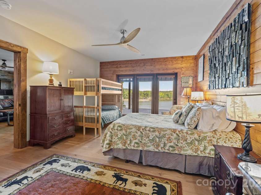 10108 Saw Mill Road, Charlotte, NC 28278.  MLS# CAR4268919, YatesRealty ID 25740. Second bedroom in basement with doors leading to lower covered deck