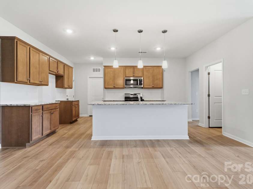 219 Rodeo Drive, Shelby, NC 28150.  MLS# CAR4368777, YatesRealty ID 25743. Great Room into kitchen