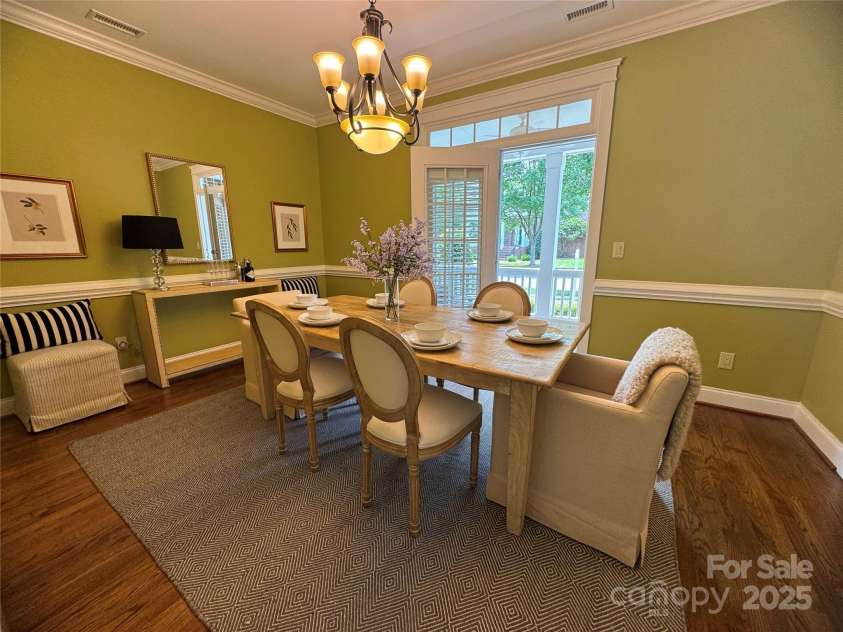 108 Forrester Avenue, Belmont, NC 28012.  MLS# CAR4265770, YatesRealty ID 25744. The Dining Room is spacious and has beautiful hardwood floors and this room features French doors leading to the covered front porch