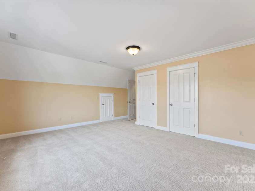 108 Forrester Avenue, Belmont, NC 28012.  MLS# CAR4265770, YatesRealty ID 25744. The oversized closet is a dream.  There are two attic access for additional storage in this room!