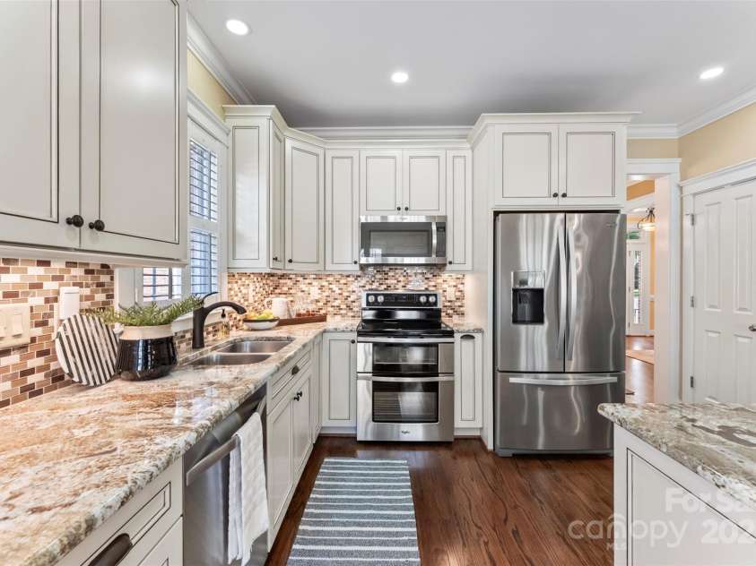 108 Forrester Avenue, Belmont, NC 28012.  MLS# CAR4265770, YatesRealty ID 25744. Under cabinet lighting and stainless steel appliances adore this beautiful Kitchen.