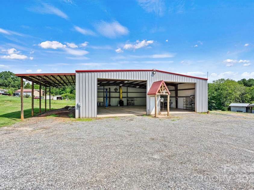 3724 County Home Road, Conover, NC 28613.  MLS# CAR4275725, YatesRealty ID 25751. 60 x 60 Metal Shop with 16 x 40 Lean-To