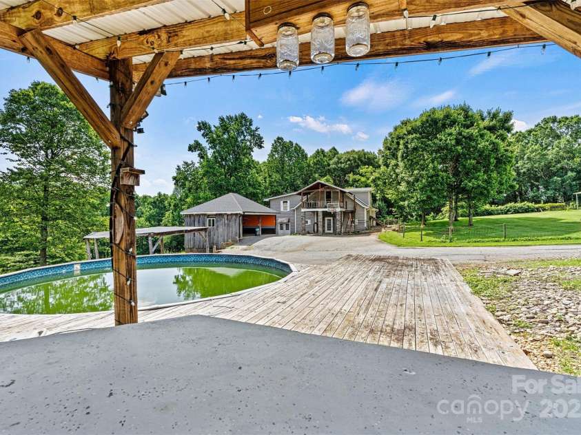 3724 County Home Road, Conover, NC 28613.  MLS# CAR4275725, YatesRealty ID 25751. Above Ground Pool/House View
