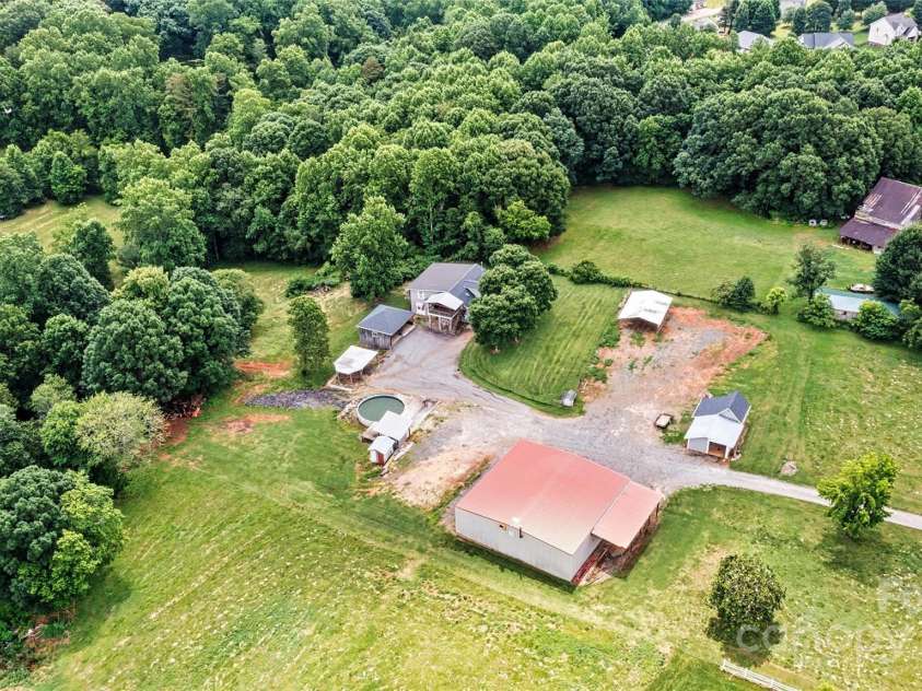 3724 County Home Road, Conover, NC 28613.  MLS# CAR4275725, YatesRealty ID 25751. Aerial Focused Side View