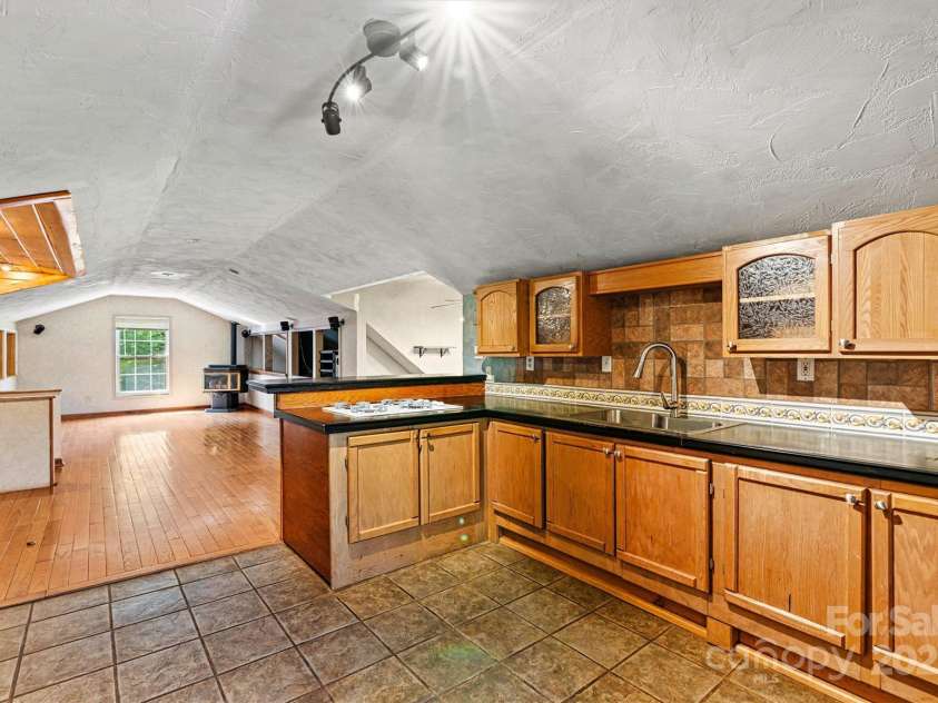 3724 County Home Road, Conover, NC 28613.  MLS# CAR4275725, YatesRealty ID 25751. Kitchen/Living Room View