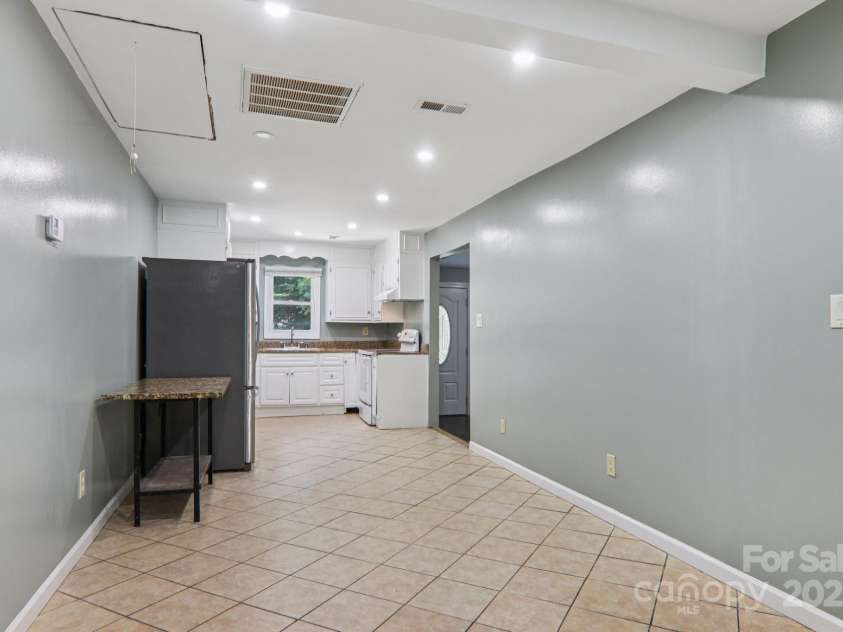 1416 Roy Dula Place, Lenoir, NC 28645.  MLS# CAR4279035, YatesRealty ID 25757. Kitchen and space for table