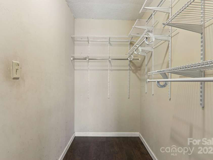 1416 Roy Dula Place, Lenoir, NC 28645.  MLS# CAR4279035, YatesRealty ID 25757. Walk in closet in primary bedroom