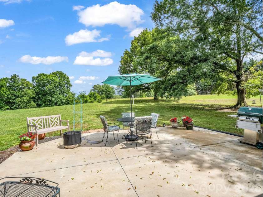 72 McEntire Road, Tryon, NC 28782.  MLS# CAR4411835, YatesRealty ID 25759. Back patio