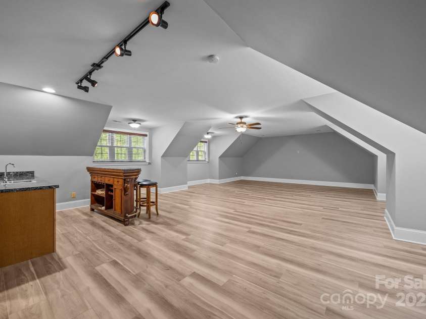 11280 Mcfalls Drive, Indian Land, SC 29707.  MLS# CAR4225880, YatesRealty ID 25762. Before ad after picture showing new floors and paint.