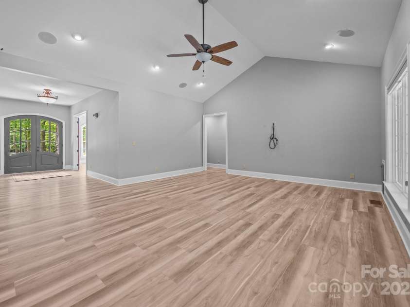 11280 Mcfalls Drive, Indian Land, SC 29707.  MLS# CAR4225880, YatesRealty ID 25762. Before and after picture showing new floors and paint.