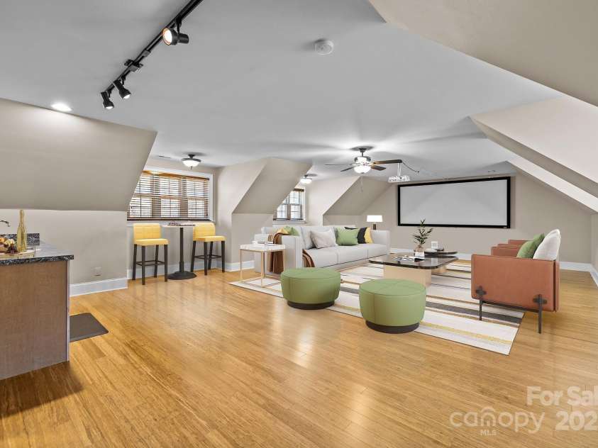 11280 Mcfalls Drive, Indian Land, SC 29707.  MLS# CAR4225880, YatesRealty ID 25762. The 2nd level bonus room is a favorite of the current owners. This well-appointed space creates many home lifestyle opportunities. The giant screen and projector are included.