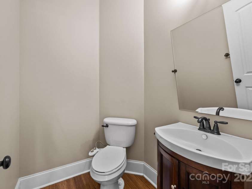 11280 Mcfalls Drive, Indian Land, SC 29707.  MLS# CAR4225880, YatesRealty ID 25762. The main level guest powder room is demure yet refined offering ample space and quality finishes.