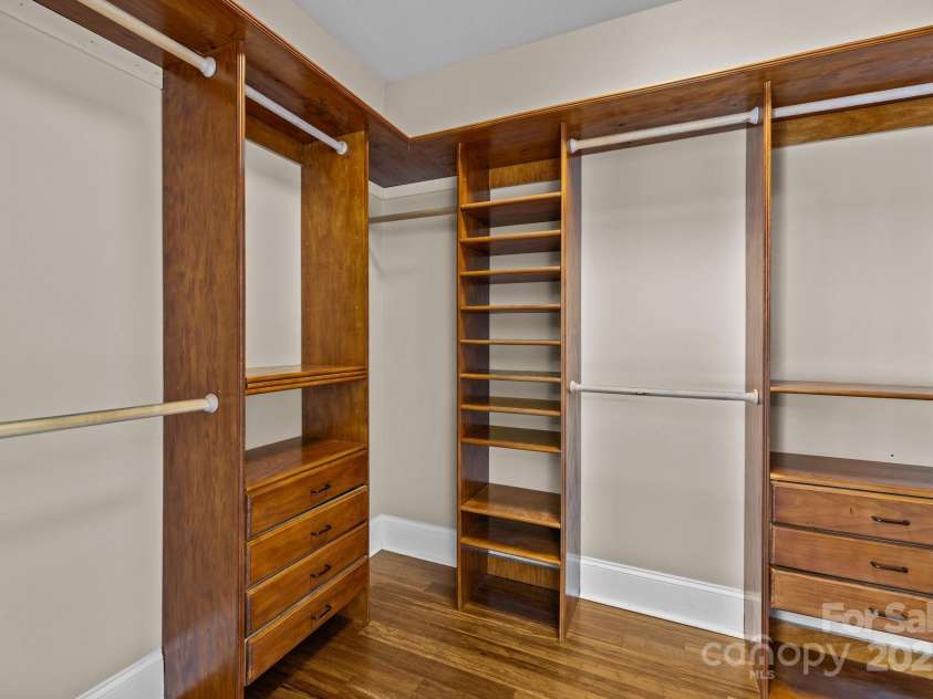 11280 Mcfalls Drive, Indian Land, SC 29707.  MLS# CAR4225880, YatesRealty ID 25762. The primary suite features an impressive custom built closet design with an abundance of storage possibilities.