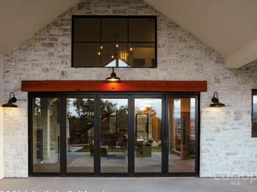 Lot 1 Country Estates Drive, Waxhaw, NC 28173.  MLS# CAR4276299, YatesRealty ID 25764. View of Patio Doors Looking from Covered Porch into the Living Room of the Proposed Modern Farmhouse