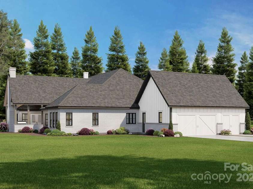 Lot 4 Country Estates Drive, Waxhaw, NC 28173.  MLS# CAR4278303, YatesRealty ID 25767. The combination of vertical board-and-batten siding, light-colored brick, and black-framed windows continues the elegant, contemporary farmhouse style.