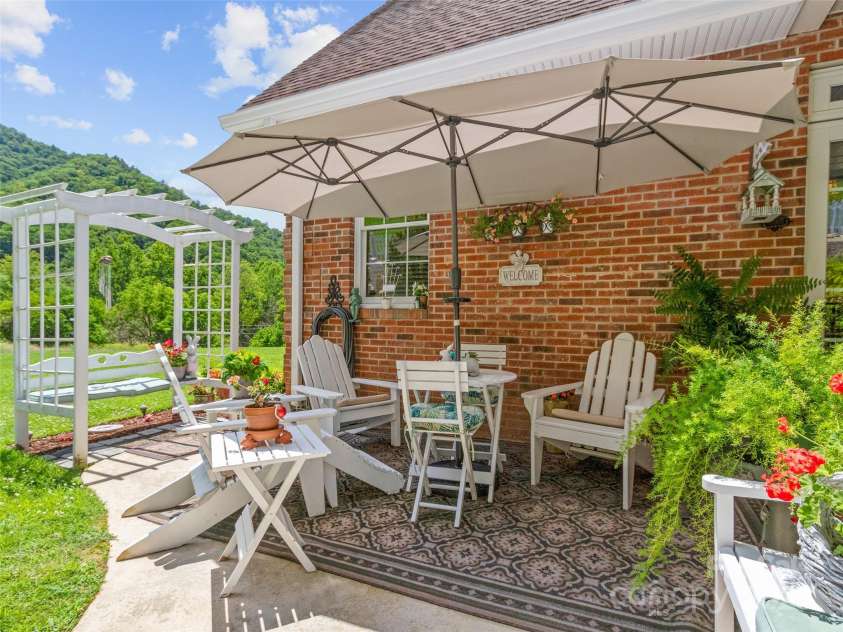38 Peterson Lane, Green Mountain, NC 28740.  MLS# CAR4279349, YatesRealty ID 25769. Rear patio