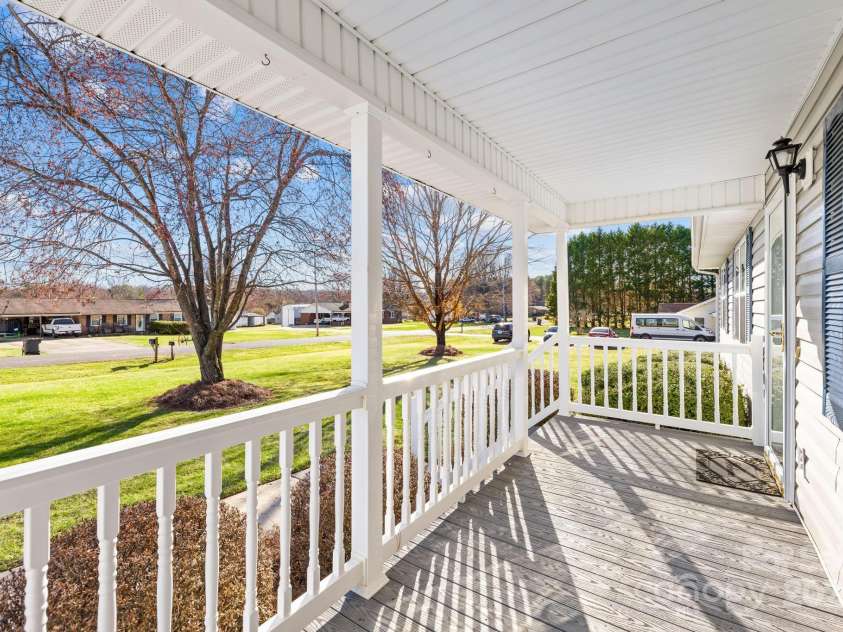 341 Massey Deal Road, Statesville, NC 28625.  MLS# CAR4228351, YatesRealty ID 2577. Front porch with shade trees