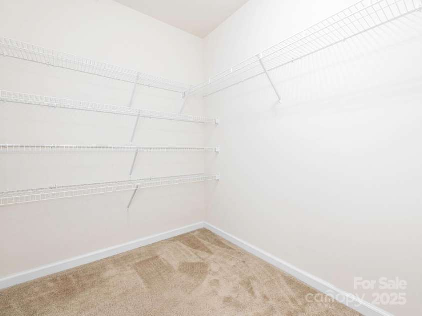 709 Volta Drive, Concord, NC 28027.  MLS# CAR4267575, YatesRealty ID 25770. Master Walk in closet