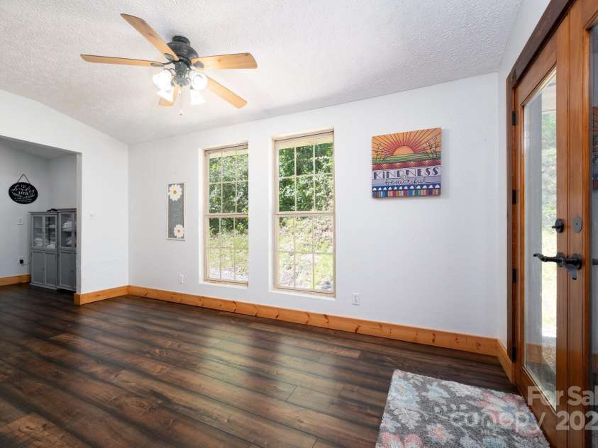 104 Riddle Cove Road, Maggie Valley, NC 28751.  MLS# CAR4257628, YatesRealty ID 25771. Sunny flex space with French doors—perfect for an office, reading nook, or creative studio.