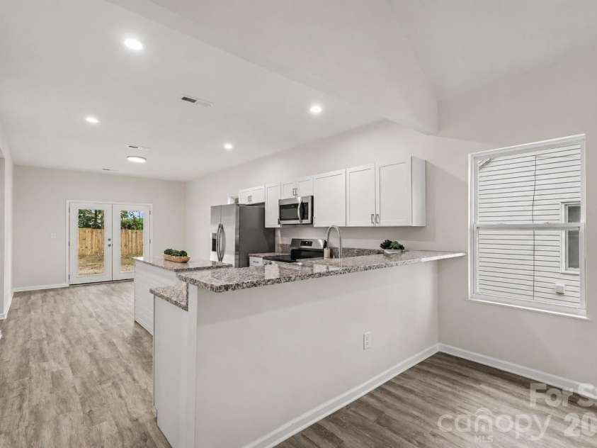 122 Johndy Avenue, Kannapolis, NC 28083.  MLS# CAR4387075, YatesRealty ID 25792. Bar height seating area