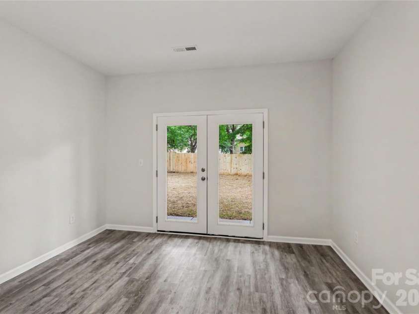 122 Johndy Avenue, Kannapolis, NC 28083.  MLS# CAR4387075, YatesRealty ID 25792. Dining area leading out to back patio