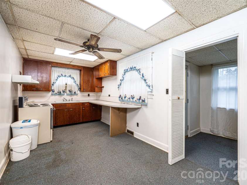 408 US Hwy 70A E Highway, Hildebran, NC 28637.  MLS# CAR4382969, YatesRealty ID 25800. Kitchen (Utility Room to right)