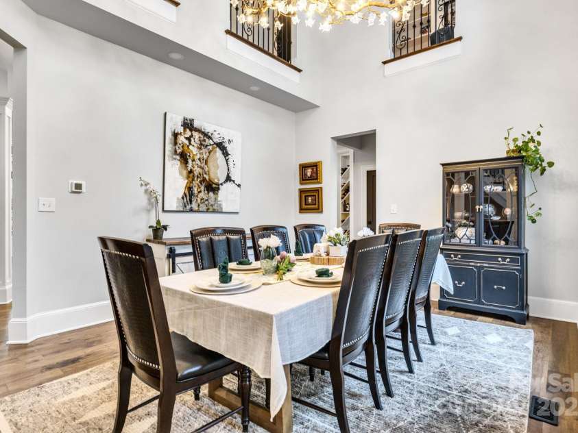 6327 Fox Tail Lane, Davidson, NC 28036.  MLS# CAR4271331, YatesRealty ID 25803. 2-Story Dining room has (3) Juliet Balconies overlooking from upper level