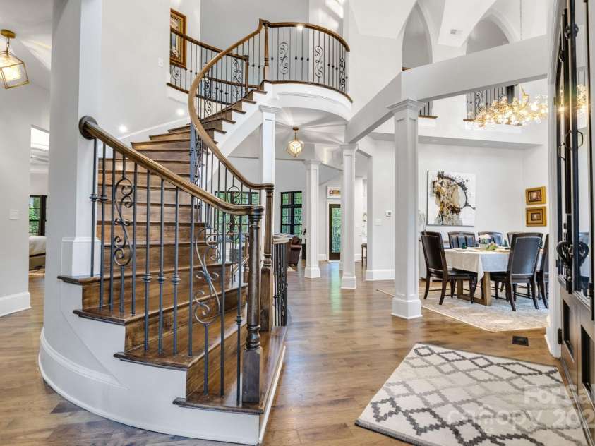 6327 Fox Tail Lane, Davidson, NC 28036.  MLS# CAR4271331, YatesRealty ID 25803. 3-Story spiral stair case in the foyer as you enter the house.