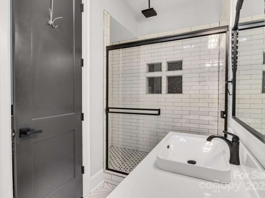 6327 Fox Tail Lane, Davidson, NC 28036.  MLS# CAR4271331, YatesRealty ID 25803. Basement - Full bath with custom tile shower.