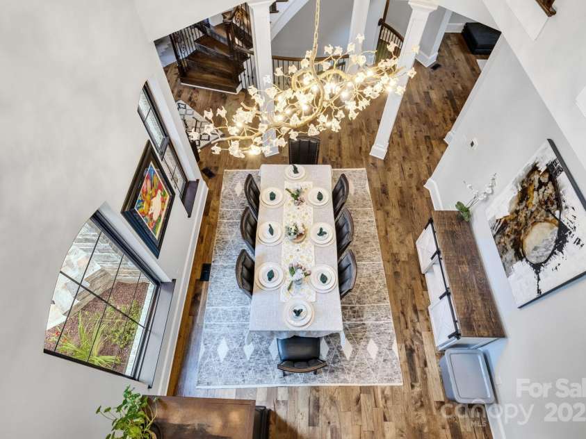 6327 Fox Tail Lane, Davidson, NC 28036.  MLS# CAR4271331, YatesRealty ID 25803. View of the dining room from Juliet balcony in second floor office.